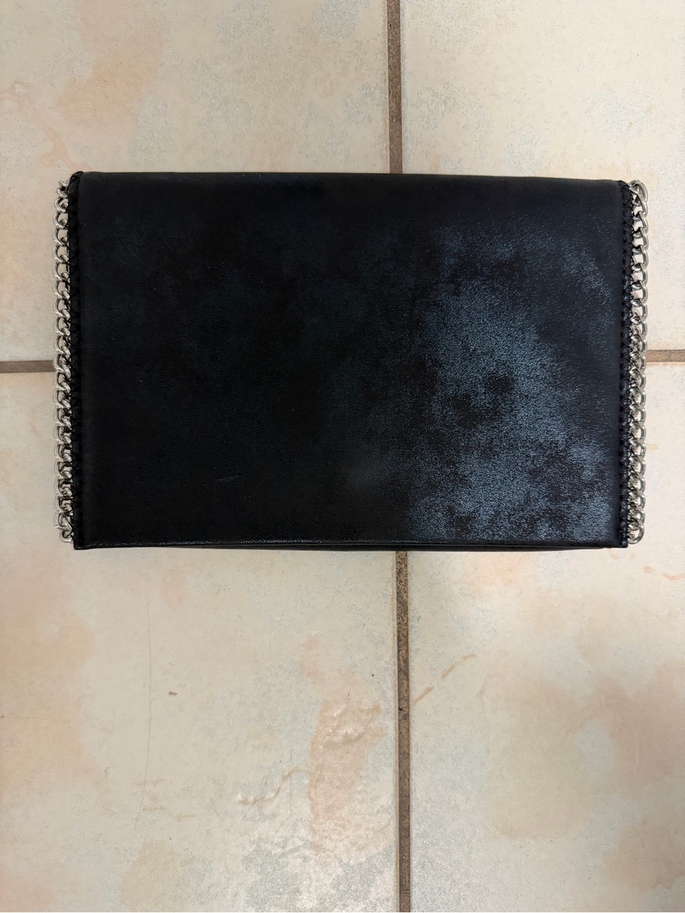 Chelsea28 Black Textured Brush
Finish Vegan Leather Crossbody with Silver Chain